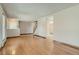 Spacious living room featuring hardwood floors and convenient access to other rooms at 4351 E 109Th Ave, Thornton, CO 80233
