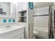 Clean bathroom with tiled shower, white vanity, and modern fixtures, offering a fresh and stylish space at 9375 W David Ave, Littleton, CO 80128