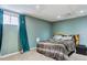 The basement bedroom features an accent wall and cozy decor at 9375 W David Ave, Littleton, CO 80128