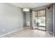 Cozy dining area featuring tile floors and a sliding glass door to the backyard patio at 9375 W David Ave, Littleton, CO 80128