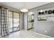 Charming dining area with tile floors, backyard access, and an open view to the kitchen at 9375 W David Ave, Littleton, CO 80128