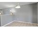 Bright dining room with tiled floors and a modern light fixture, ideal for Gathering meals at 9375 W David Ave, Littleton, CO 80128