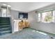Cozy loft area featuring a large window, gray walls, and soft carpet, perfect for relaxing at 9375 W David Ave, Littleton, CO 80128