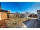 Backyard view with a small shed and partially fenced-in area, ready for landscaping at 832 Dahlia St, Denver, CO 80220