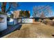 Backyard view of building with partial privacy fence, shed and ready for landscaping at 832 Dahlia St, Denver, CO 80220