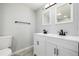 Bathroom featuring double sink, white vanity, and tile flooring at 832 Dahlia St, Denver, CO 80220