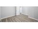 An airy bedroom with gray wood-look flooring and fresh white trim at 832 Dahlia St, Denver, CO 80220