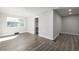 Bright, airy bedroom with gray wood-look flooring and fresh white trim at 832 Dahlia St, Denver, CO 80220