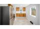 Modern kitchen with stainless steel appliances and bright tile flooring at 832 Dahlia St, Denver, CO 80220
