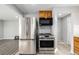 Kitchen area showcasing stainless steel appliances and modern design at 832 Dahlia St, Denver, CO 80220