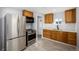 Updated kitchen featuring stainless appliances, bright backsplash, and ample cabinet space at 832 Dahlia St, Denver, CO 80220