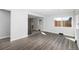 Spacious living room highlighting updated flooring, bright lighting, and ample space at 832 Dahlia St, Denver, CO 80220