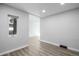 Bright, airy living room with gray wood-look floors and fresh white trim at 832 Dahlia St, Denver, CO 80220