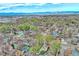 Aerial view of neighborhood homes with mature trees and mountain views in the background at 504 Martin St, Longmont, CO 80501