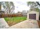 Spacious backyard featuring a detached garage, a new fence, and a lush lawn at 504 Martin St, Longmont, CO 80501