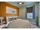 Comfortable bedroom with a large window, stylish decor, and warm color accents, offering a relaxing atmosphere at 504 Martin St, Longmont, CO 80501