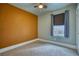 Cozy bedroom with carpet flooring, a window with blinds, and neutral wall colors, providing a blank canvas at 504 Martin St, Longmont, CO 80501