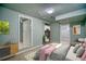 Bedroom featuring neutral carpet, with walk-in closet, and space for a sitting area at 504 Martin St, Longmont, CO 80501