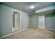 Bedroom featuring neutral carpet, and two doorways to other spaces at 504 Martin St, Longmont, CO 80501