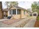 Charming bungalow with a screened-in porch and long driveway leading to detached garage at 504 Martin St, Longmont, CO 80501