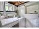 Laundry room featuring washer, dryer, utility sink and storage in the basement at 504 Martin St, Longmont, CO 80501