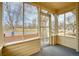 View from inside the screened front porch overlooking the neighborhood street at 504 Martin St, Longmont, CO 80501