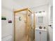 Cozy bathroom with walk-in shower, modern vanity, and ample lighting at 9656 Rensselaer Dr, Arvada, CO 80004