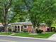 Lovely single-story home with a well-kept lawn, arched entryway, and charming details at 9656 Rensselaer Dr, Arvada, CO 80004