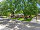 Charming home with a well-maintained lawn, mature trees, and traditional architectural features at 9656 Rensselaer Dr, Arvada, CO 80004