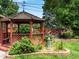 Charming gazebo with views of the backyard landscaping and gardens at 9656 Rensselaer Dr, Arvada, CO 80004