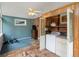 Laundry room with tile and carpet flooring, utility closet, washer and dryer at 9656 Rensselaer Dr, Arvada, CO 80004