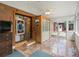Enclosed sunroom featuring tile flooring and sliding glass doors at 9656 Rensselaer Dr, Arvada, CO 80004