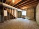 Unfinished basement space with concrete floors, exposed beams, and natural light at 4049 S Quatar St, Aurora, CO 80018