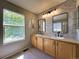 Bathroom boasts a double sink vanity, large window with lots of light, and modern fixtures at 4049 S Quatar St, Aurora, CO 80018