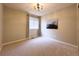 Neutral bedroom features a modern light fixture, window with curtains and a landscape painting at 4049 S Quatar St, Aurora, CO 80018