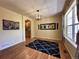 Inviting dining room with hardwood floors, a modern chandelier, and a window offering natural light at 4049 S Quatar St, Aurora, CO 80018