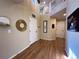 Open foyer with hardwood floors, neutral walls, and a view of the upper level, creating a grand entrance at 4049 S Quatar St, Aurora, CO 80018
