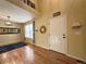 Sunlit living room with hardwood floors, tall ceilings, large windows, and neutral walls, creating a welcoming space at 4049 S Quatar St, Aurora, CO 80018