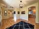 Open living space with hardwood floors, a view to the upper level, and an open view to the kitchen at 4049 S Quatar St, Aurora, CO 80018