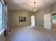 Large primary bedroom boasts vaulted ceilings, a large window, and access to the hallway at 4049 S Quatar St, Aurora, CO 80018