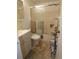 Cozy bathroom featuring tiled floors, vanity, toilet, and a shower with glass sliding doors at 2201 Sable Blvd # 1007, Aurora, CO 80011