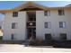 Three-story building exterior featuring multiple units and traditional architecture with plenty of windows at 2201 Sable Blvd # 1007, Aurora, CO 80011