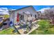 The property includes a spacious backyard and patio area, ideal for relaxing and entertaining at 2409 S Halifax Way, Aurora, CO 80013