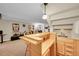 Basement bar with counter seating and easy access to the lounge at 2409 S Halifax Way, Aurora, CO 80013