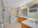 Inviting bathroom featuring double sinks, walk-in shower and bathtub at 2409 S Halifax Way, Aurora, CO 80013