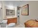Bathroom featuring a decorative mirror, wood vanity, and tiled floor, providing a stylish and functional space at 2409 S Halifax Way, Aurora, CO 80013