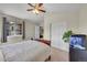 Cozy bedroom with neutral colors and a view of the neighborhood at 2409 S Halifax Way, Aurora, CO 80013