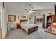 Comfortable bedroom with a ceiling fan, natural light and neutral decor at 2409 S Halifax Way, Aurora, CO 80013