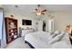 Tranquil bedroom featuring a ceiling fan and closet at 2409 S Halifax Way, Aurora, CO 80013