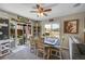 Cozy dining area with ceiling fan and sliding glass doors leading to outdoor seating at 2409 S Halifax Way, Aurora, CO 80013